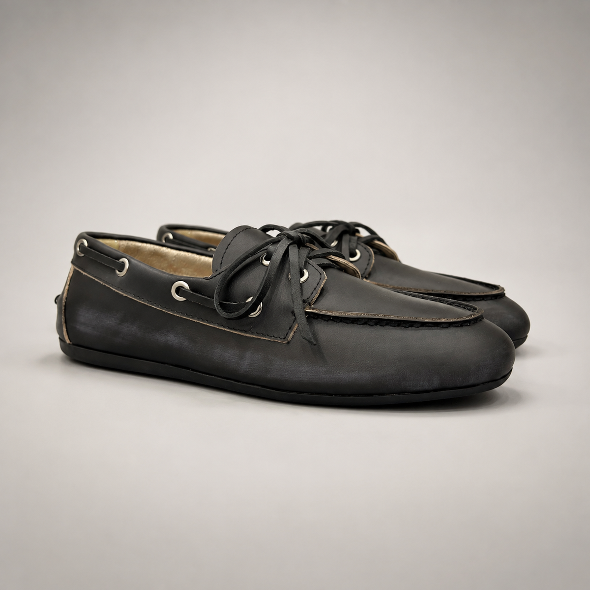 Black boat shoe pair three-quarter view