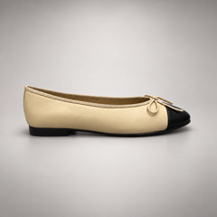 Butter yellow and black cap-toe ballet flats, side view