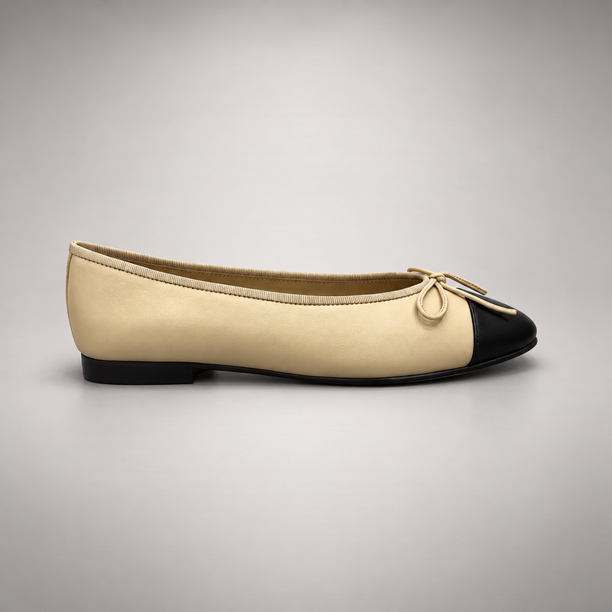 Butter yellow and black cap-toe ballet flats, side view
