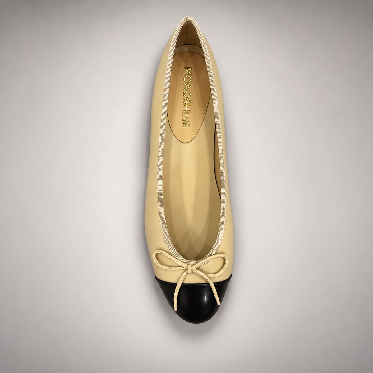 Butter yellow and black cap-toe ballet flats, back view
