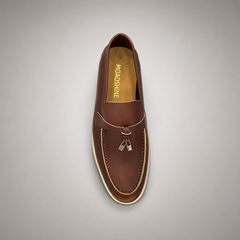 Brown loafer top view showing a metal accent across the vamp