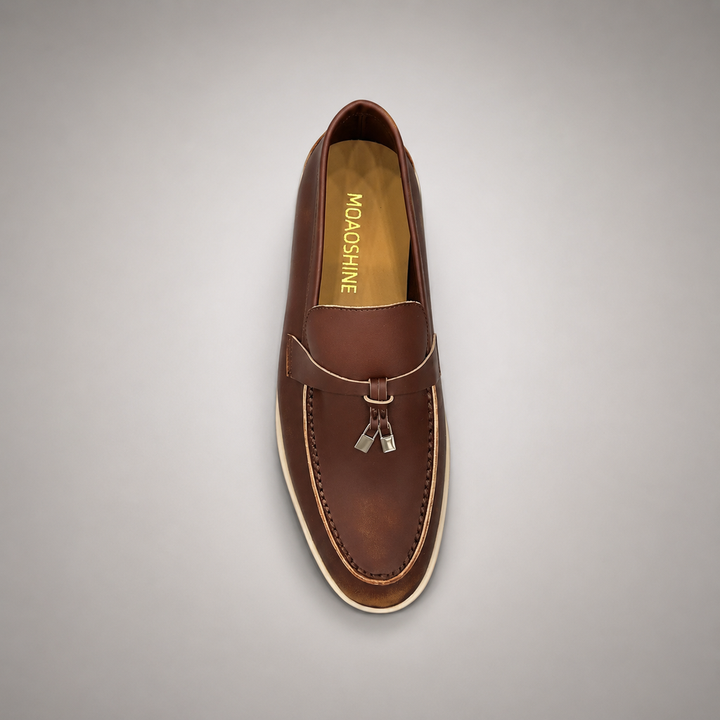 Brown loafer top view showing a metal accent across the vamp