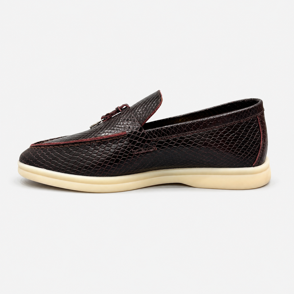 Burgundy loafer opposite side profile showing a snakeskin-pattern embossed vamp and tassel detail