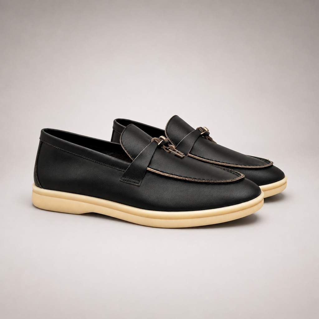 Black loafer second pair angle showing a metal accent across the vamp