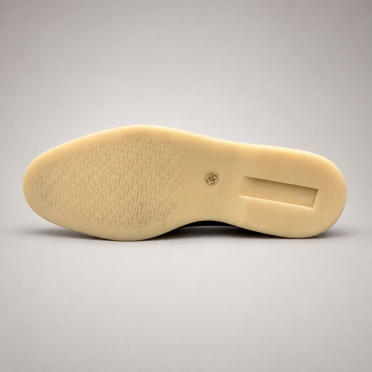 Black loafer outsole view showing the rubber outsole