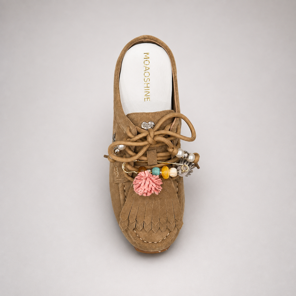 Tan moccasin sneaker outsole view showing the rubber outsole