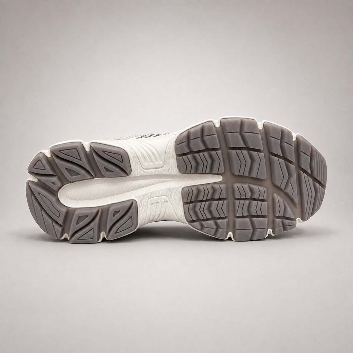 Silver sneaker outsole view showing the rubber outsole