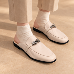 Brown washed horse leather metal-accent loafers worn with charcoal trousers and brown socks