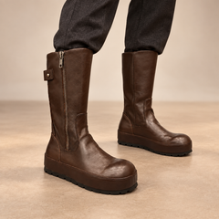 Dark-brown water-washed horse leather internal-lift mid-calf boots worn with charcoal trousers