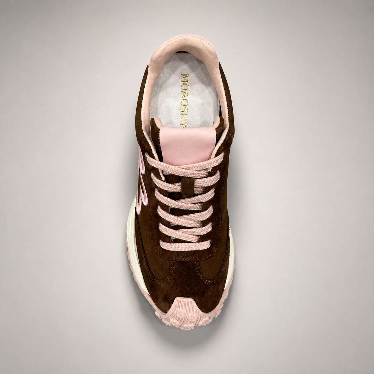 Dark Brown sneaker top view showing a panelled lace-up upper