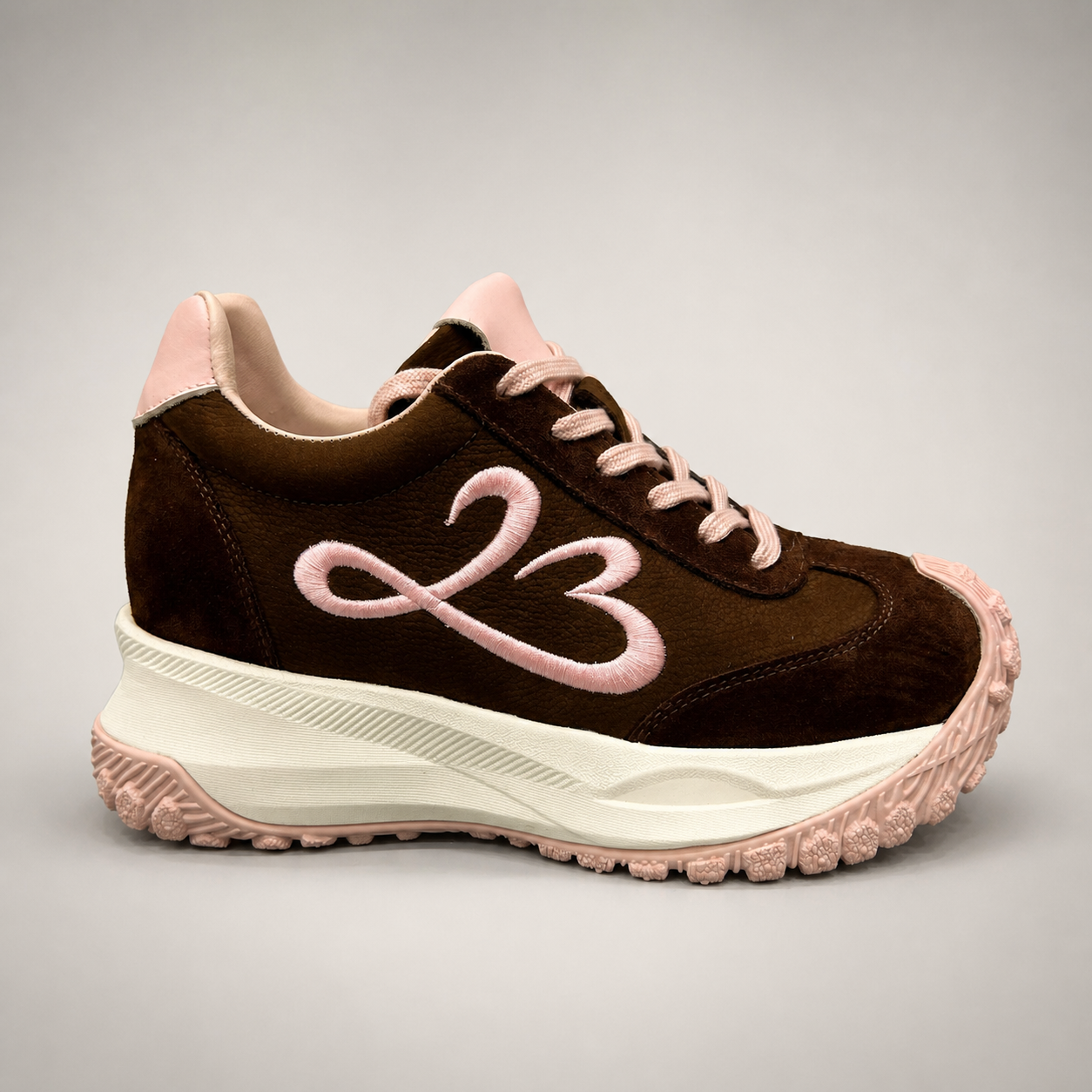 Dark Brown sneaker side profile showing a panelled lace-up upper