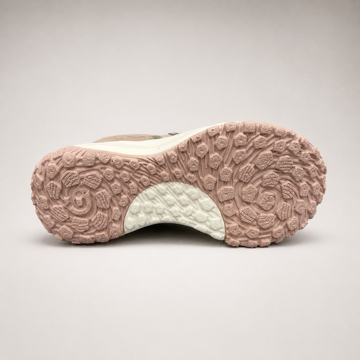 Pink sneaker outsole view showing the rubber outsole