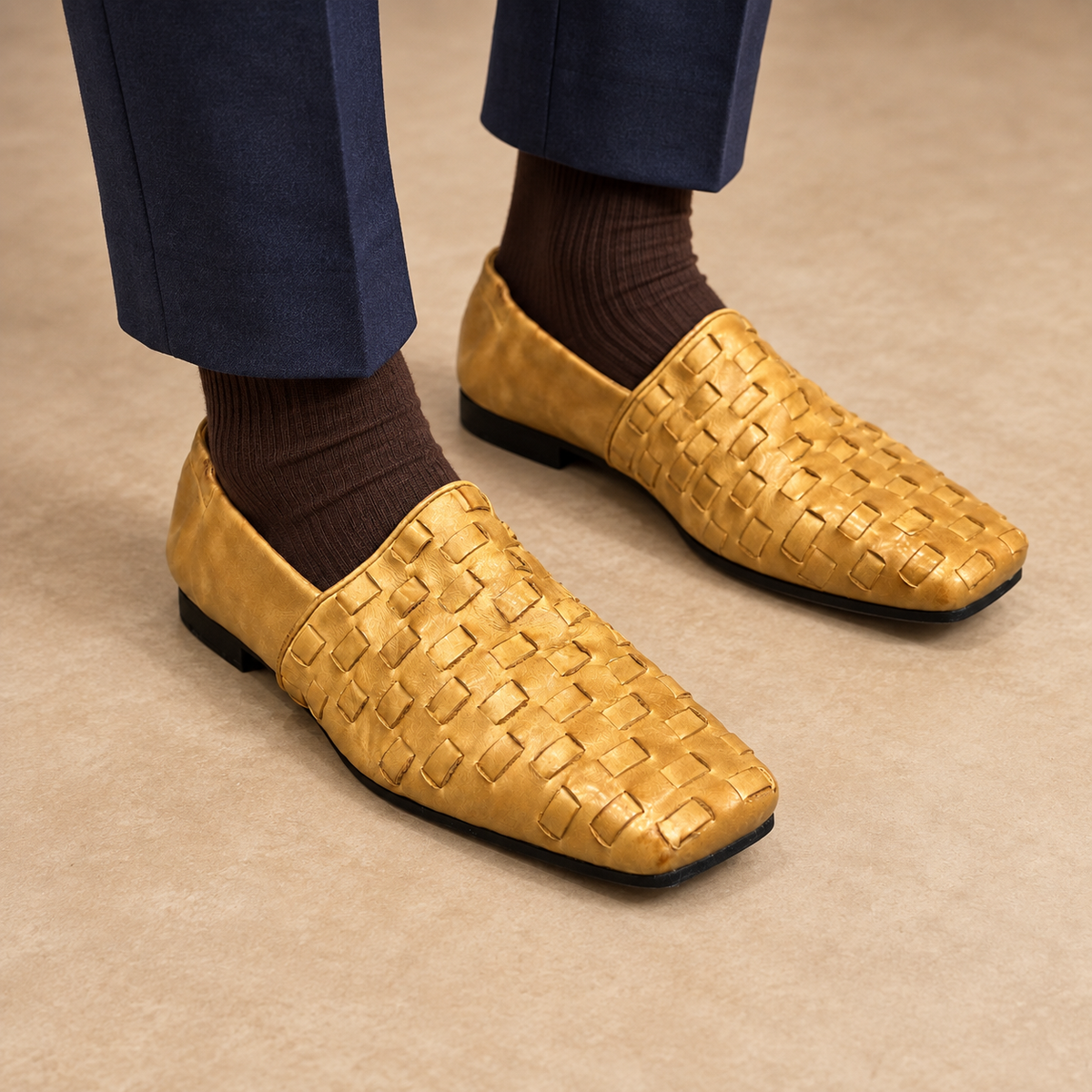 Gold washed horse leather woven loafers worn with navy trousers and brown socks