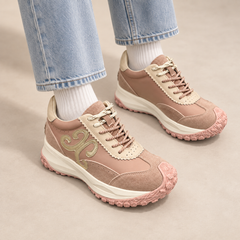Pink suede panelled lace-up sneakers worn with light denim and white socks
