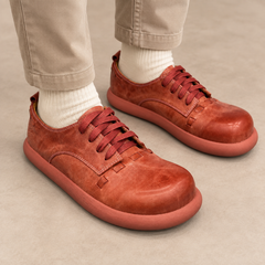 Rust washed horse leather low-top sneakers worn with stone chinos and cream socks